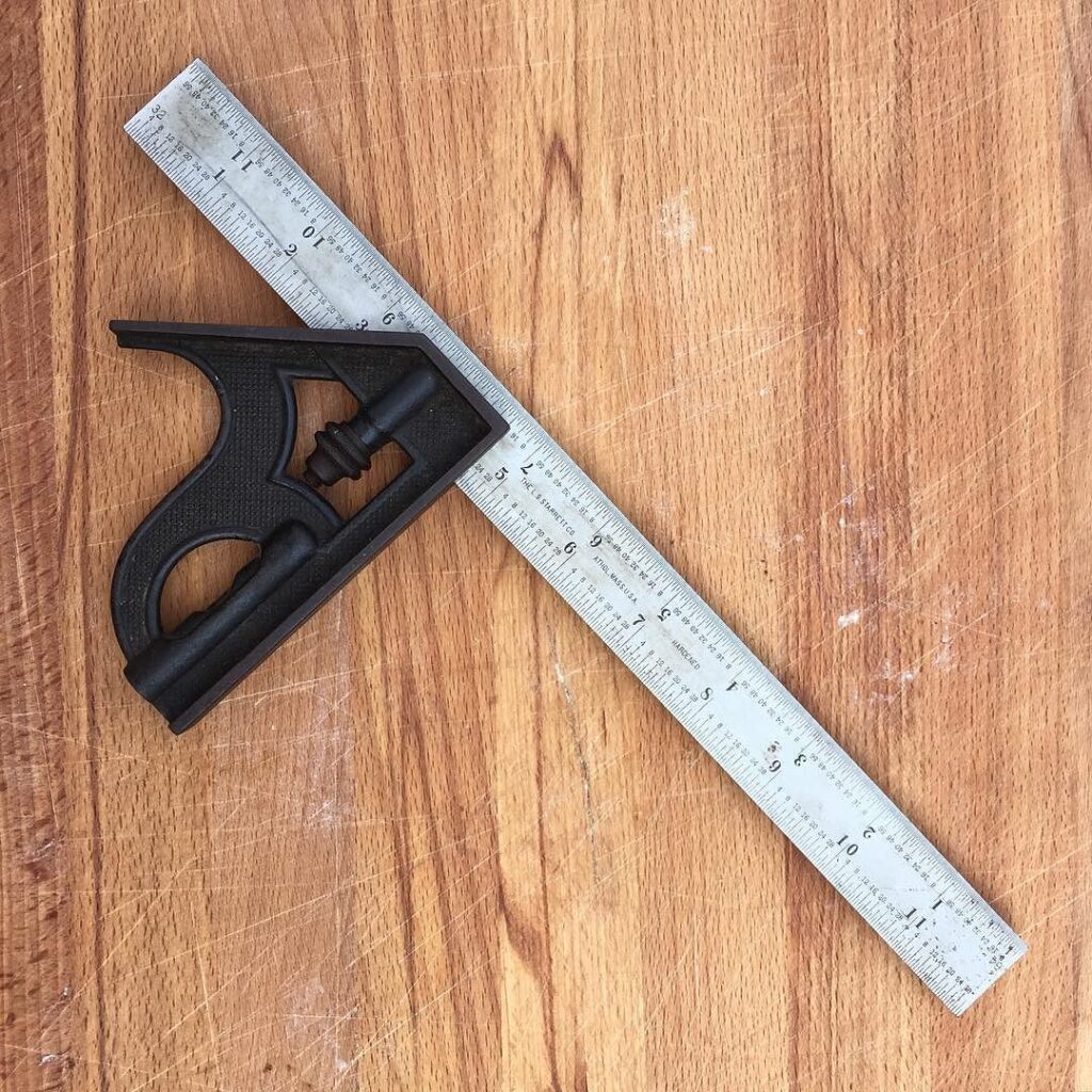 carpenter measuring woodwork combination square