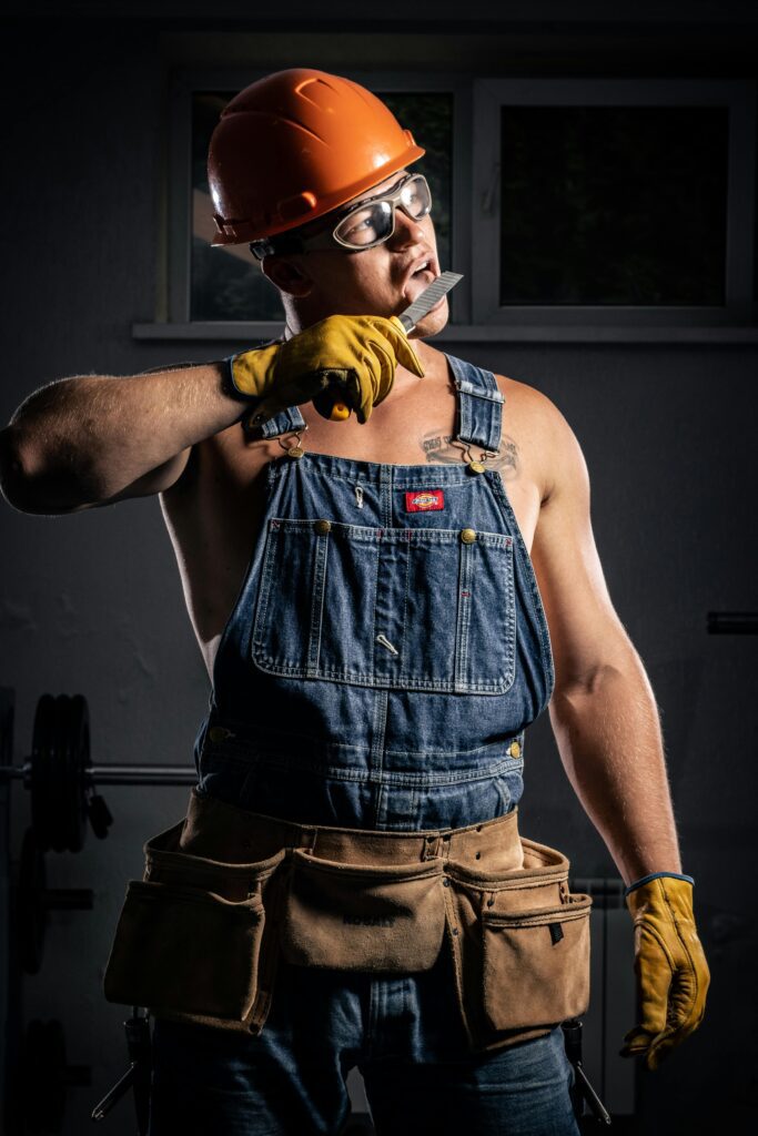 Professional carpenter wearing tool vest