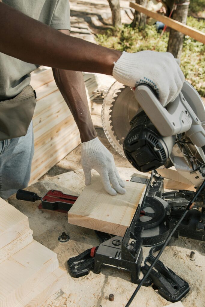 carpenter operating professional circular saw