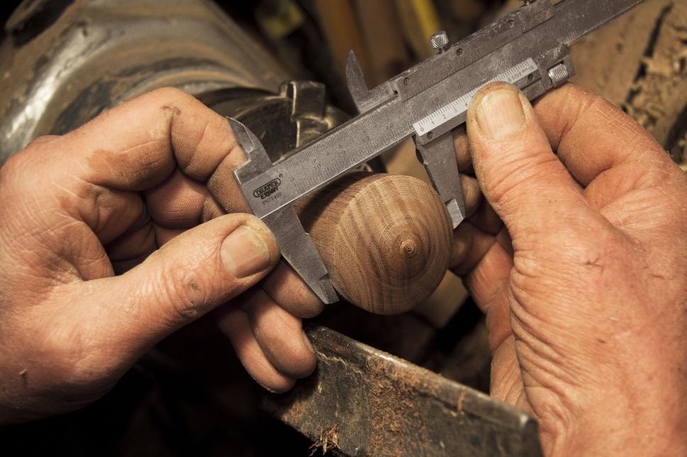 Craftsman using carpenters pincers professionally