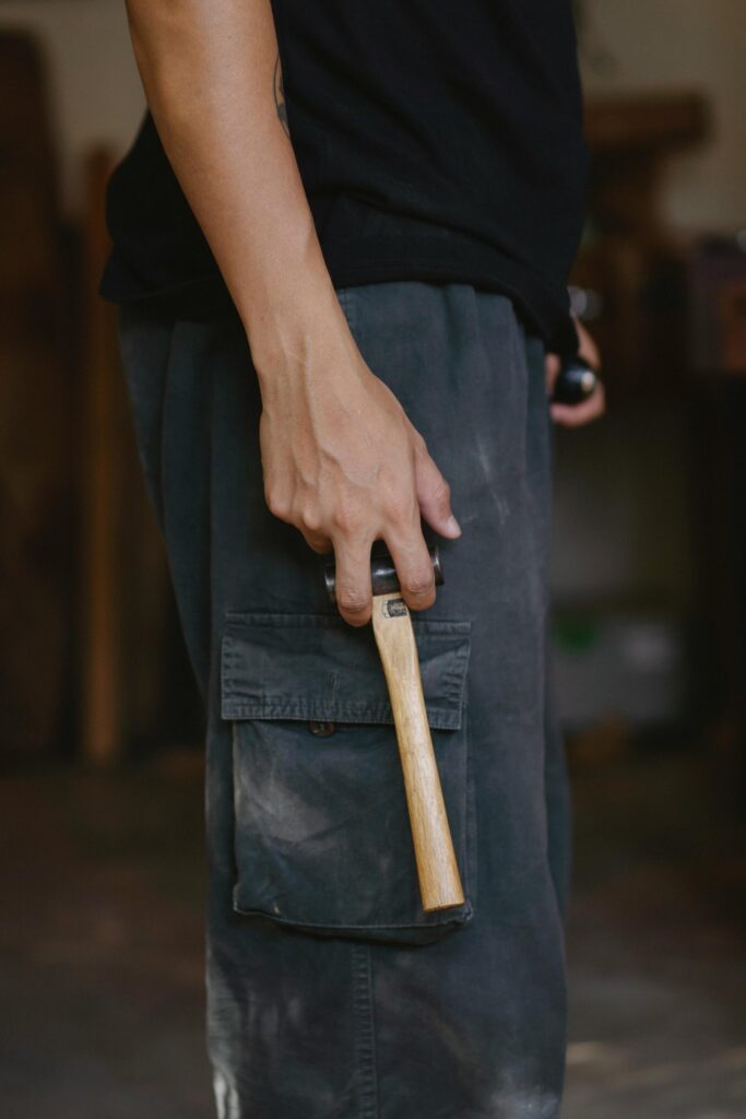 Professional carpenter wearing work trousers