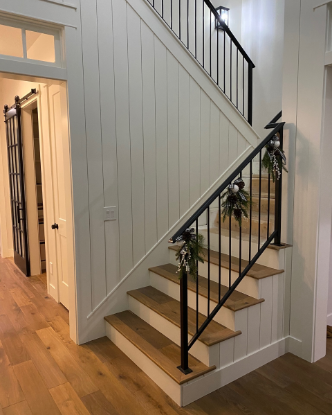 joiner crafting bespoke wooden staircase
