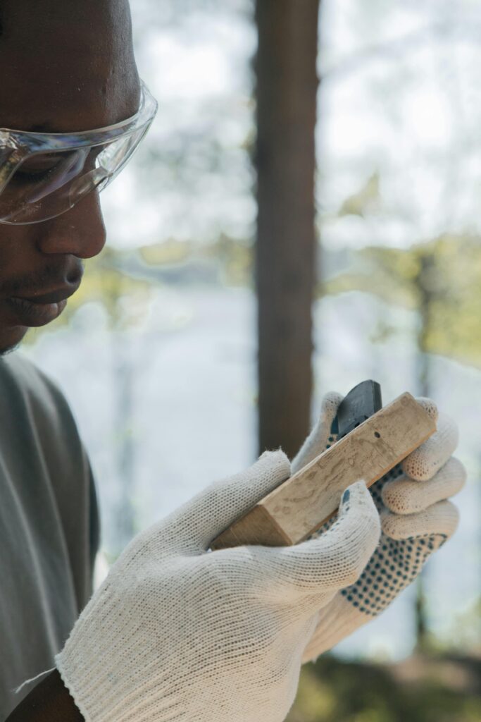 Craftsman wearing protective carpenters gloves