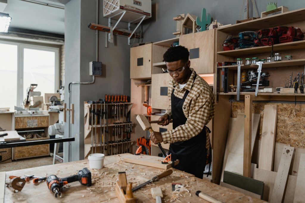 craftsman adjusting professional carpentry clamps